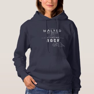Navy blue women's Christian typography hooded sweatshirt with the words: I haven't walked on water yet but I'm standing on the Rock.