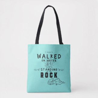 Christian typography tote bag with the words "I haven't walked on water yet but I'm standing on the Rock"